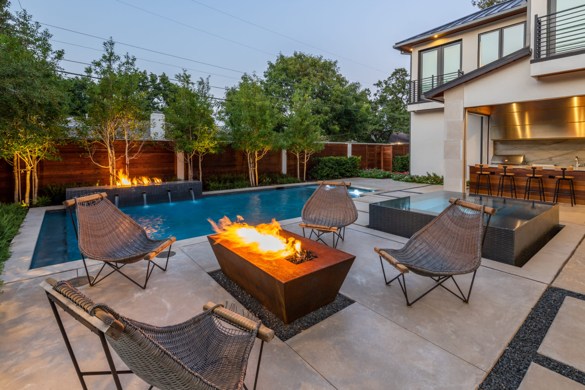 Firepit patio with outdoor seating in modern backyard