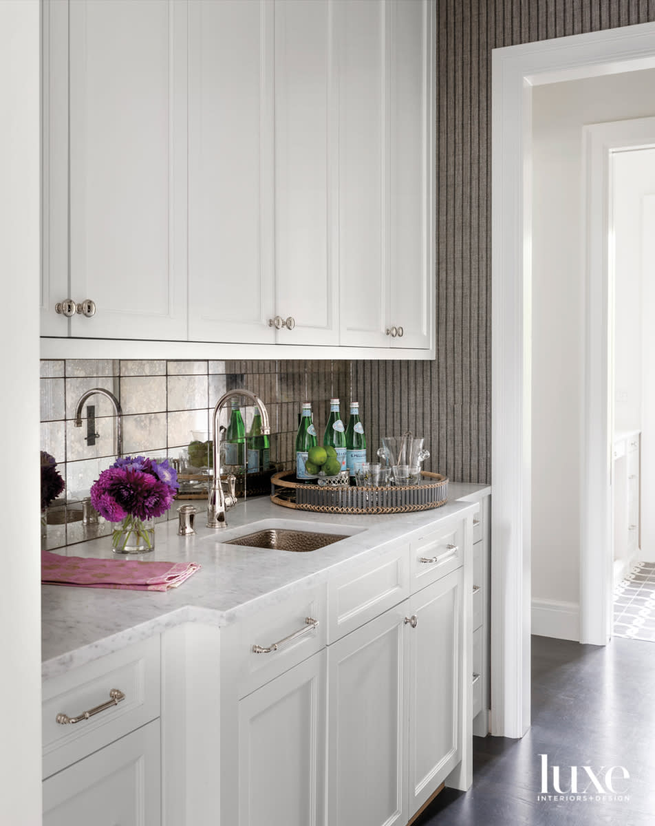 Pantry with revere painted glass tile backsplash and small sink