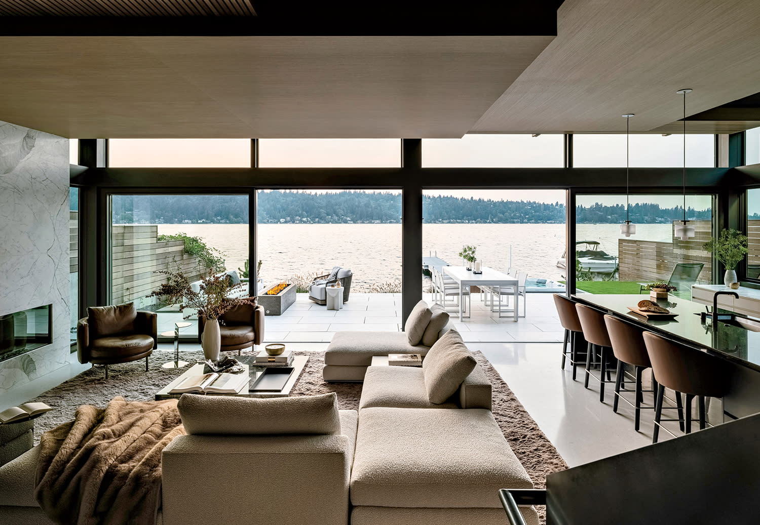 modern open concept living room and kitchen with views of Lake Washington out the window