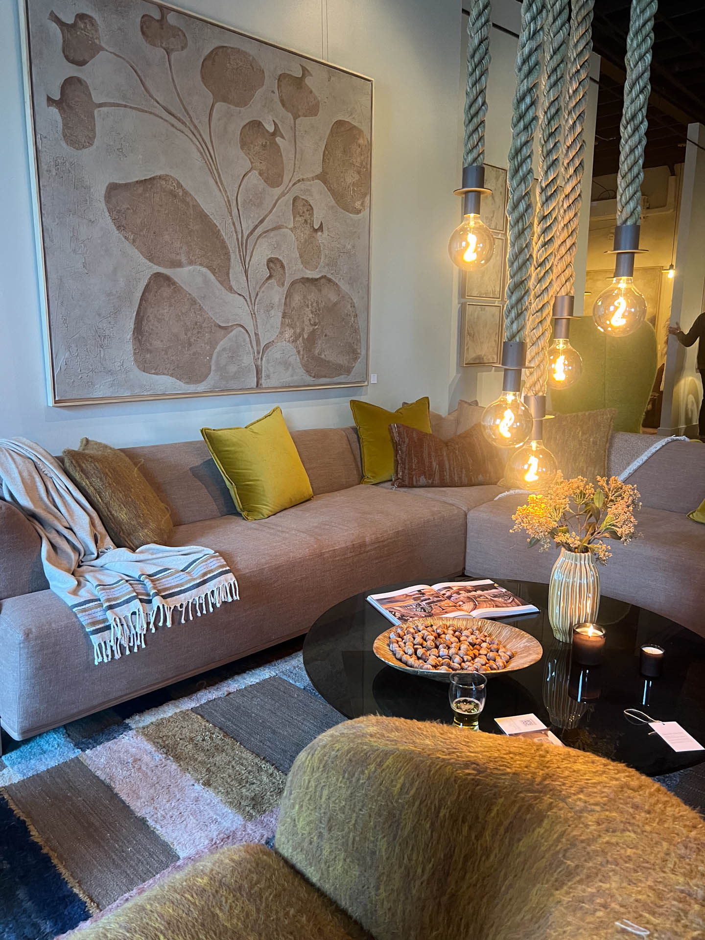 Verellen's showroom at High Point Market with a blush sofa