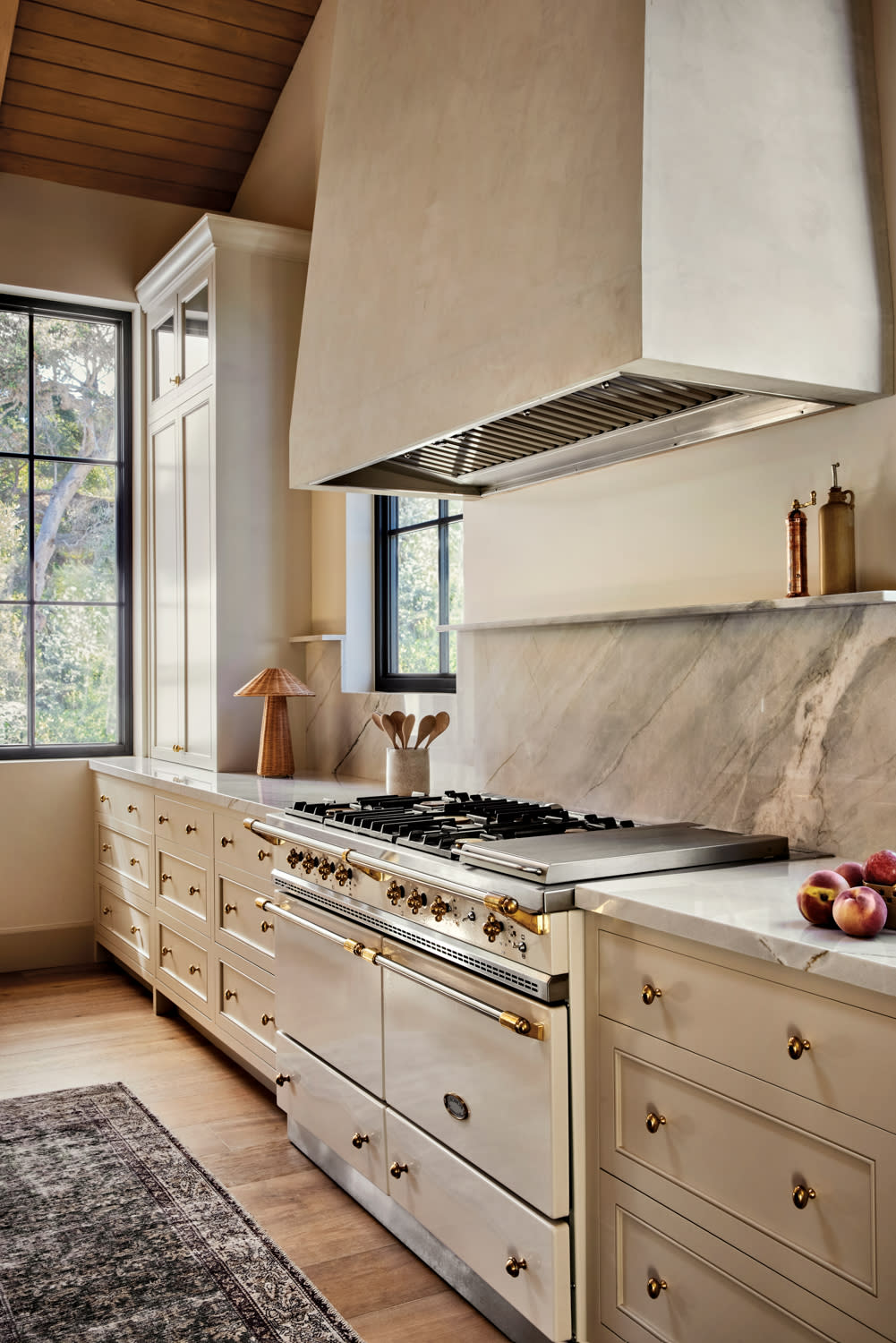 classic kitchen in a ranch-style home with a plaster range hood and white quartzite countertops