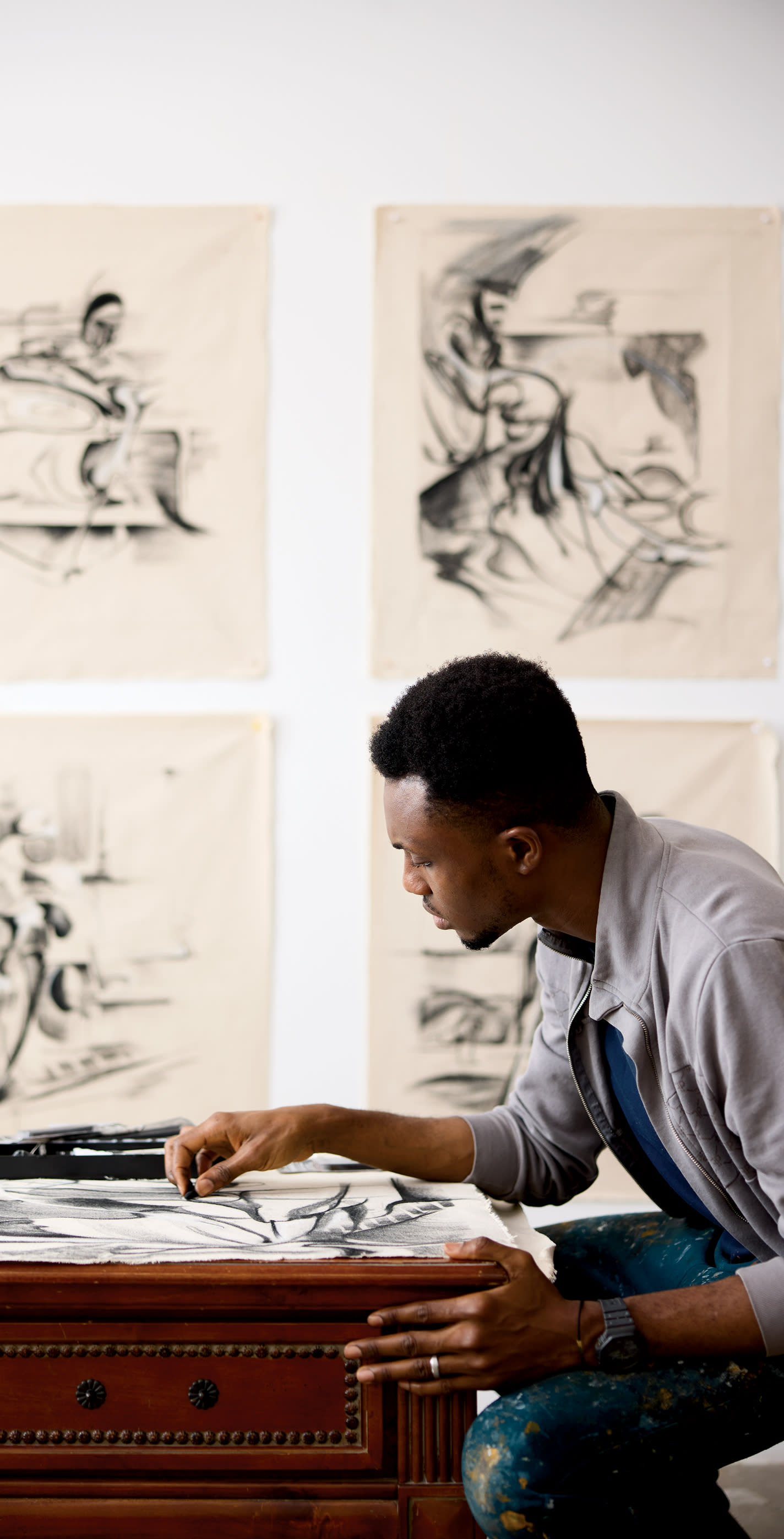 painter Luke Agada at work on a painting