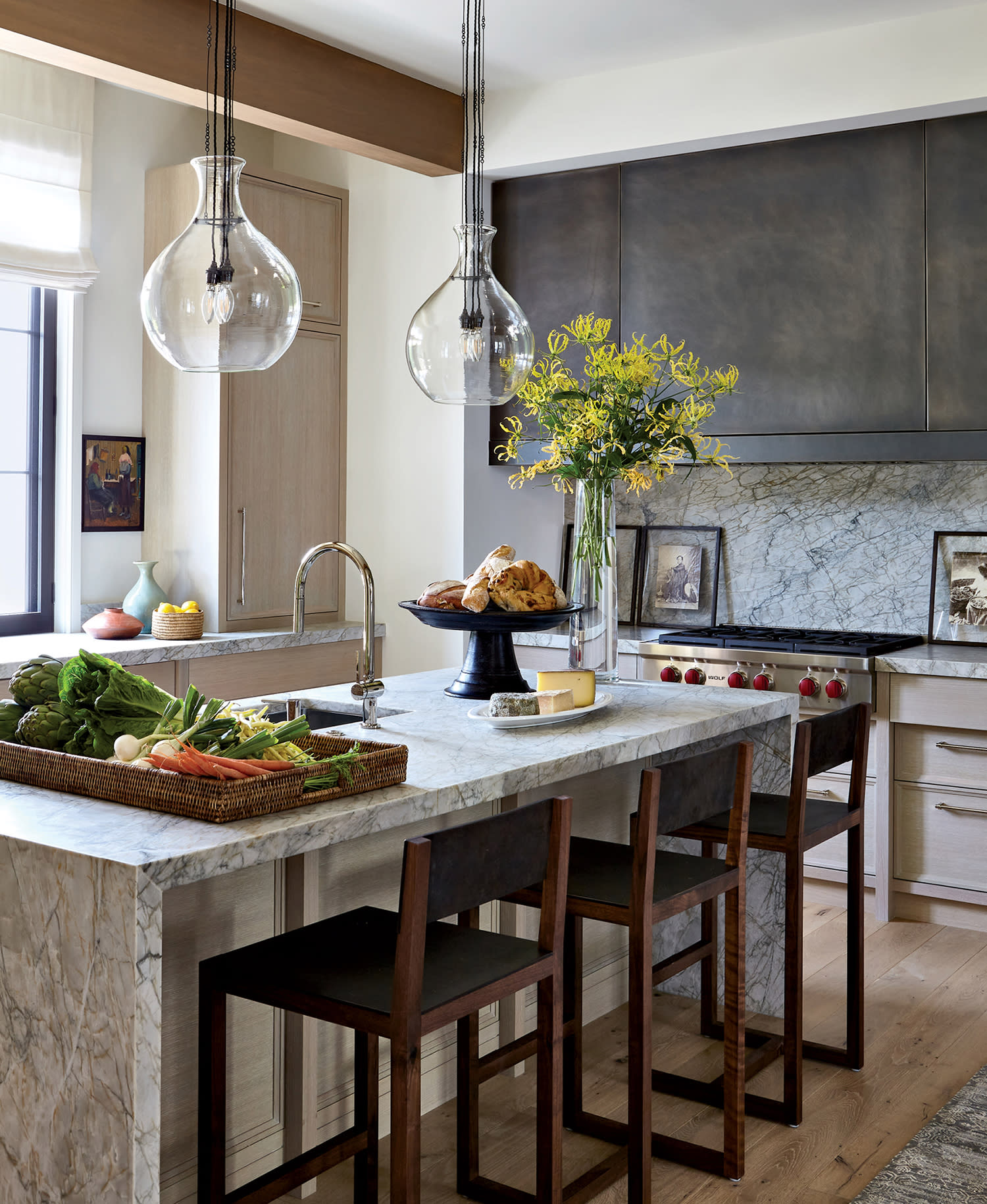 contemporary kitchen with a Ciot quartzite island and matching backsplash