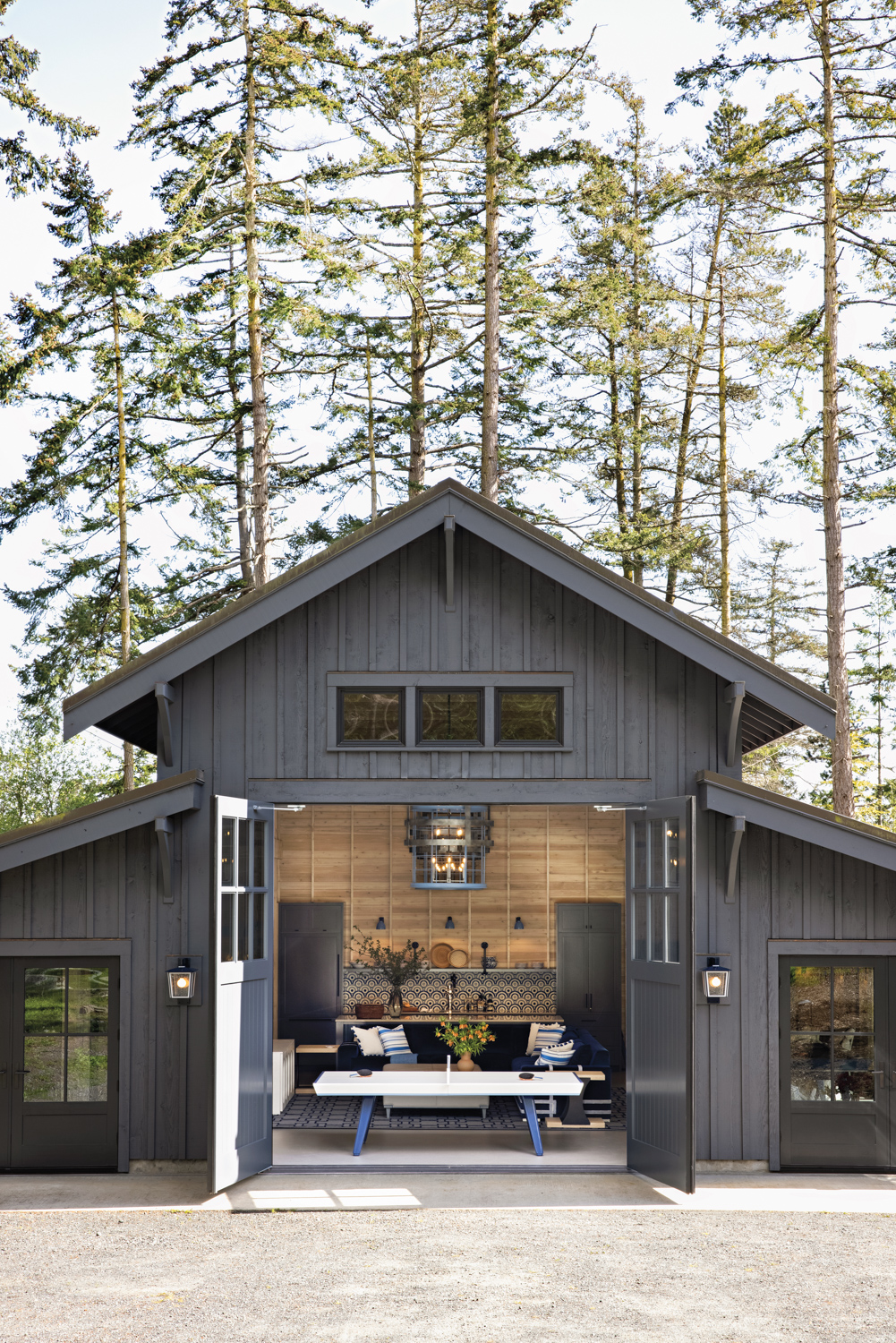 close-up of the exterior facade of a black farmhouse-style pool house