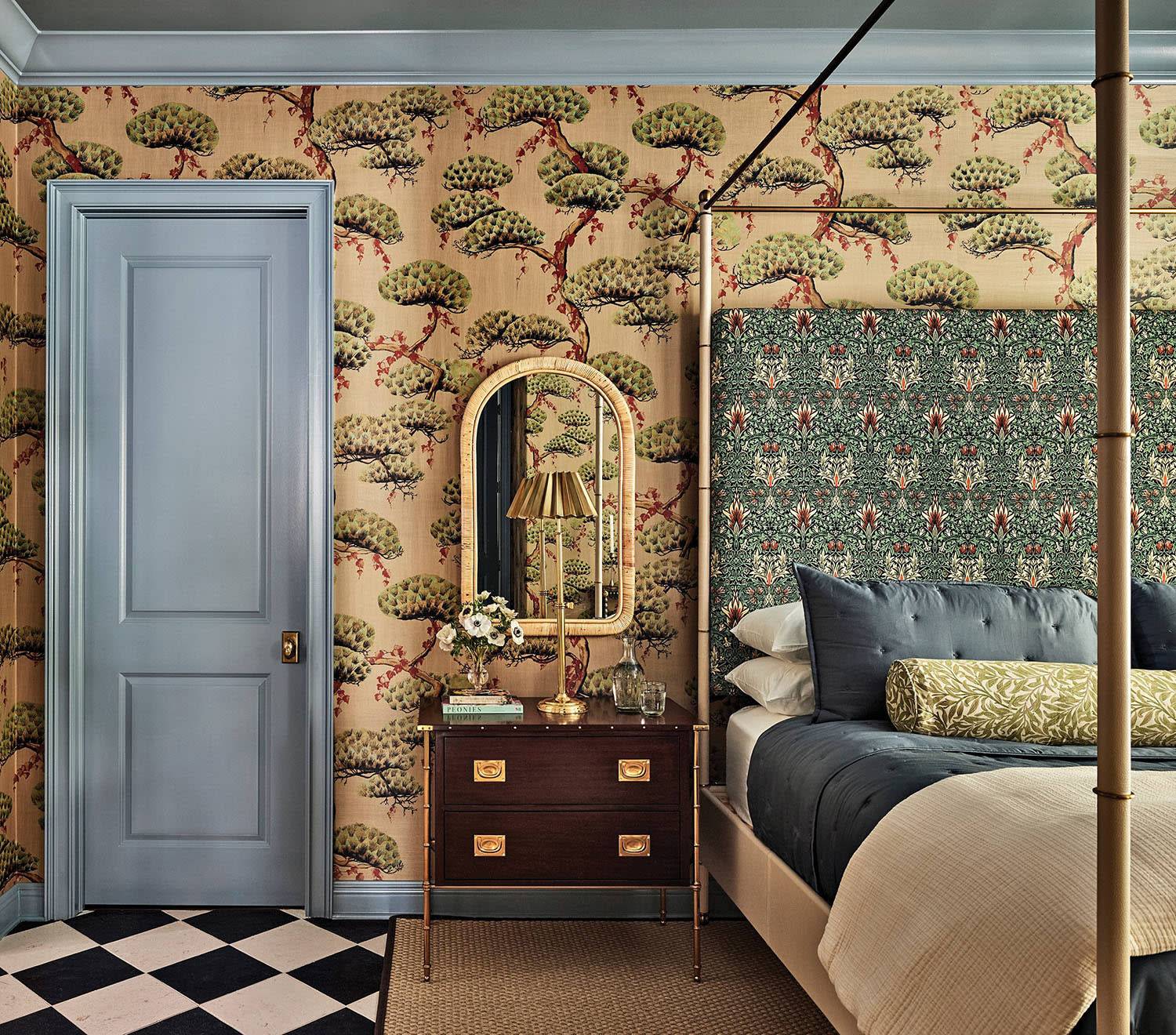 bedroom with a Pierre Frey wallpaper and a bed with a headboard upholstered in a Morris & Co. textile