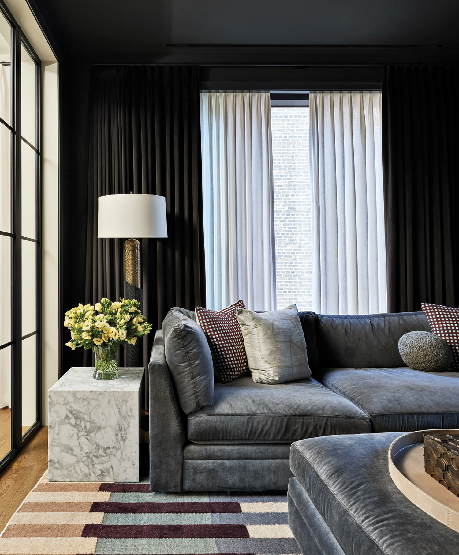 dark, moody den with a grey sectional