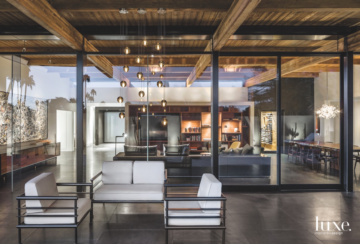 modern exterior sitting area near living room glass windows