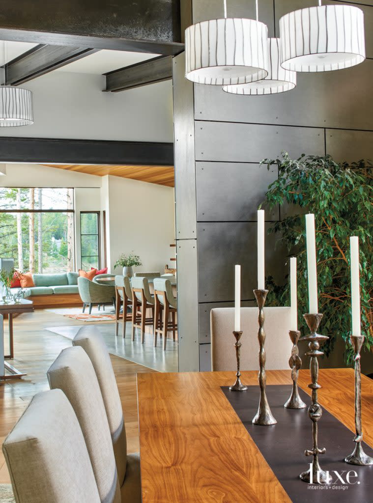 dining room table with bronze inset and drum pendants