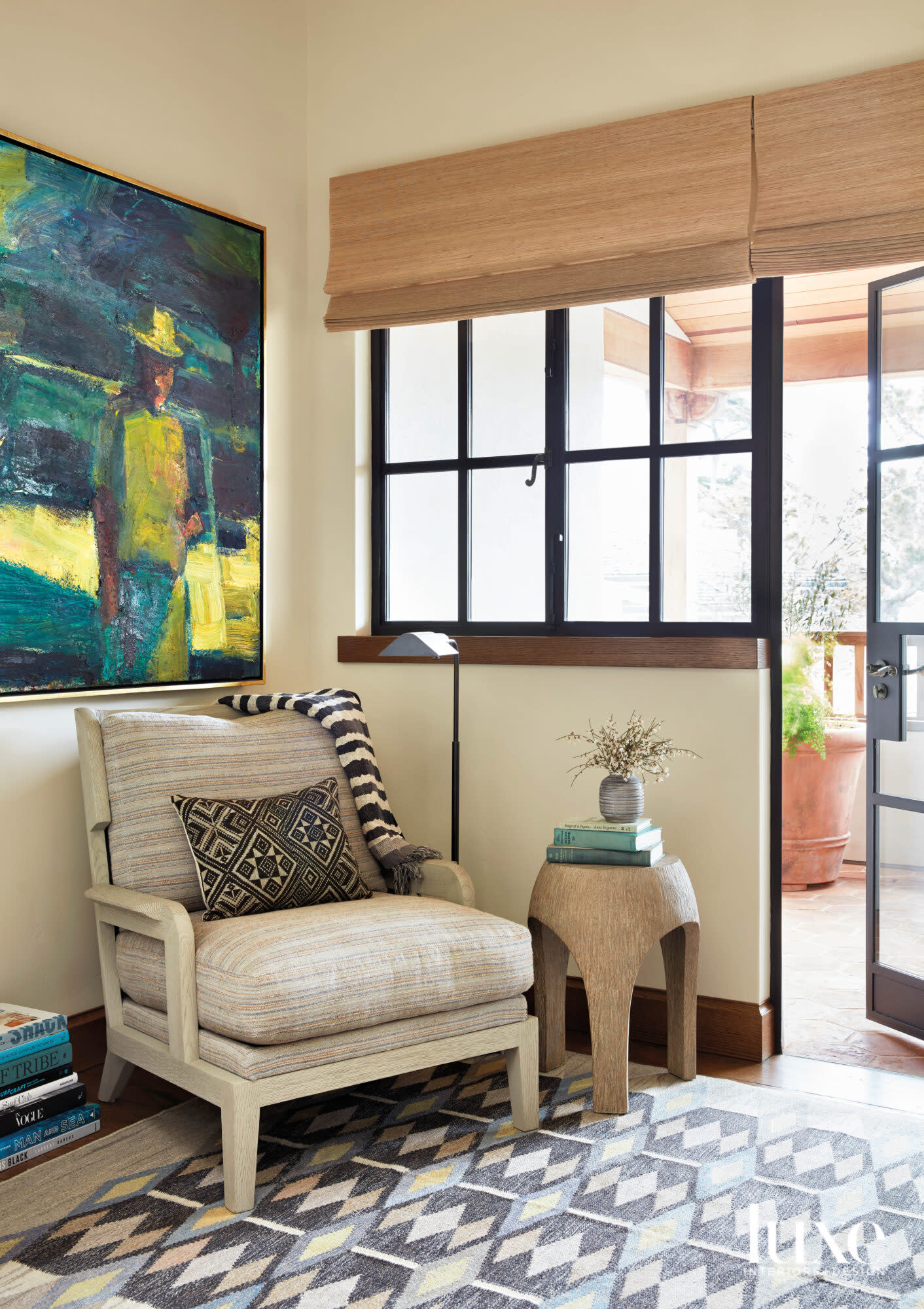 living room with armchair and colorful art