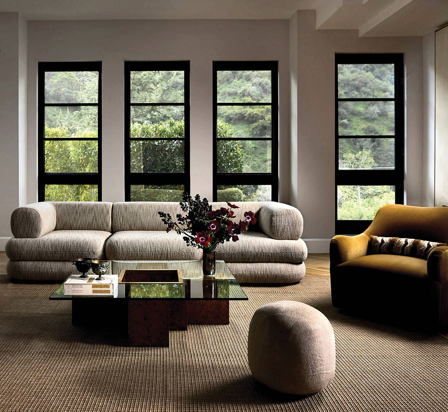 a couch and armchair that belong to Nina Takesh Furniture's debut line