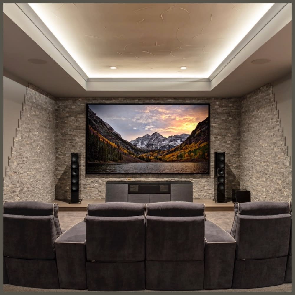 An inviting home theater showcasing a large screen and plush seating, designed for optimal entertainment enjoyment.