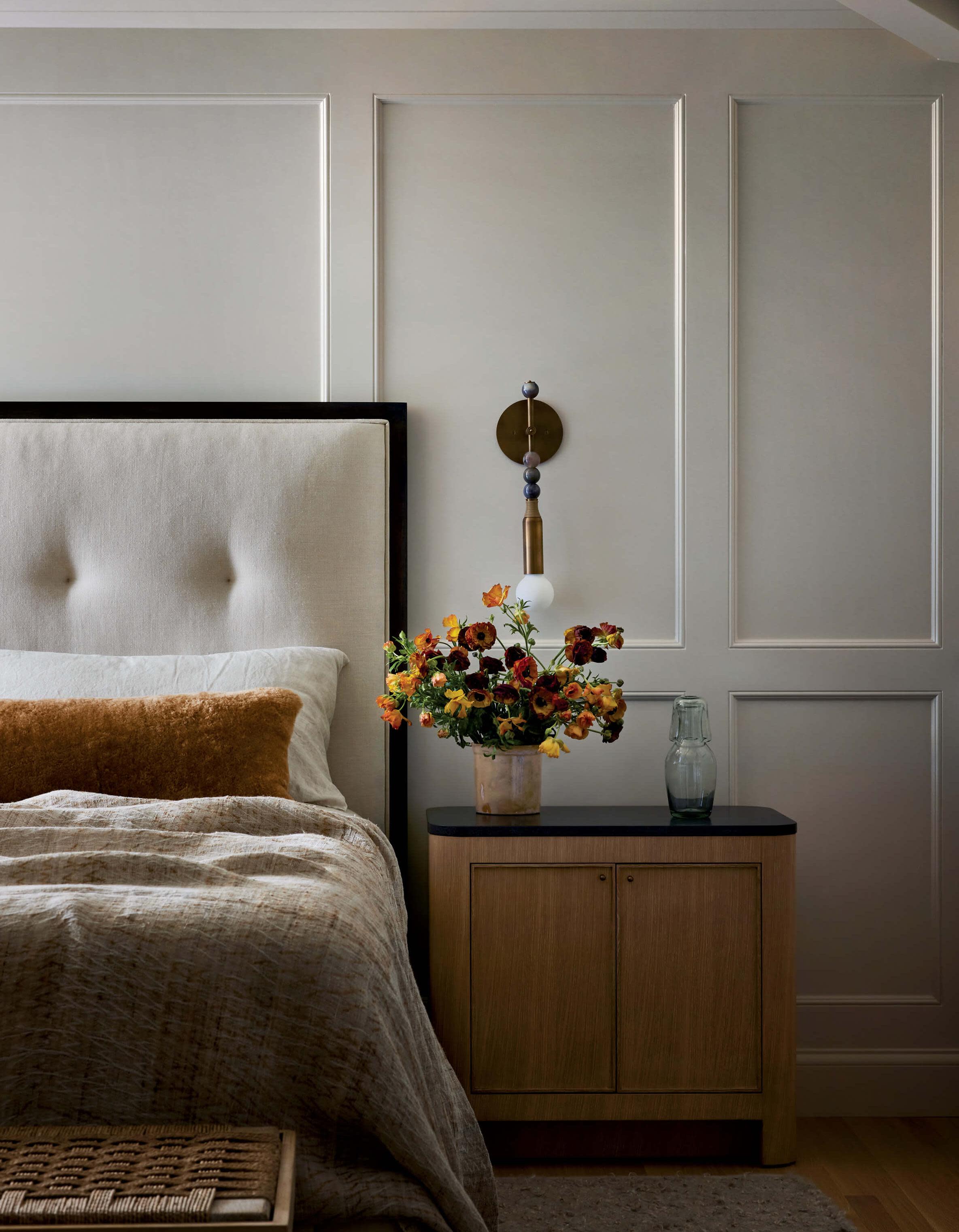 white batten board walls in a bedroom with a cozy neutral color scheme