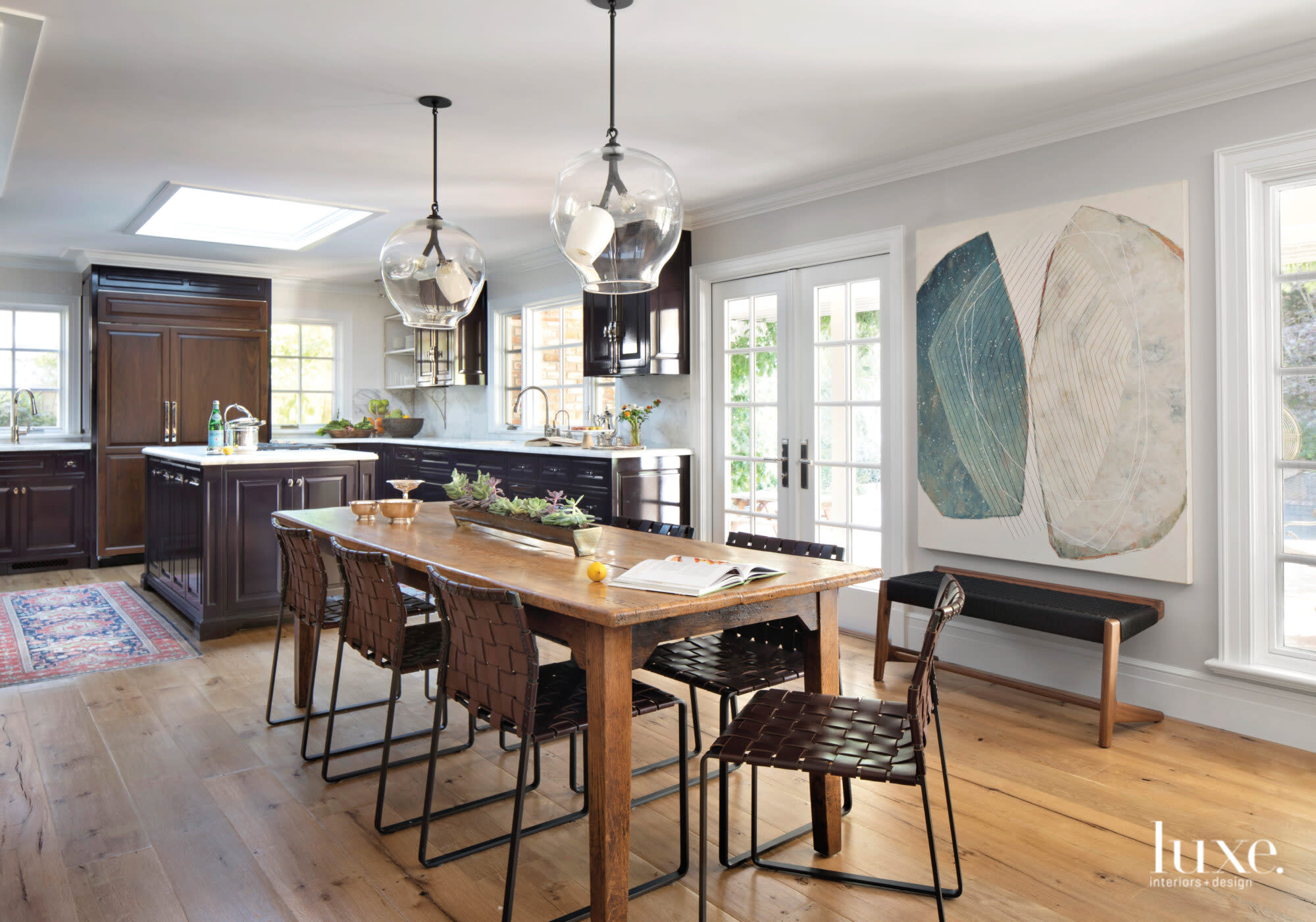 Just outside the kitchen, a long table provides family seating.