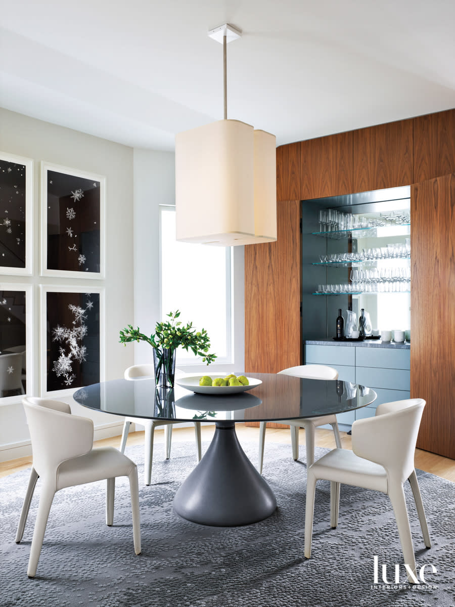 dining room with walnut casework and dry bar