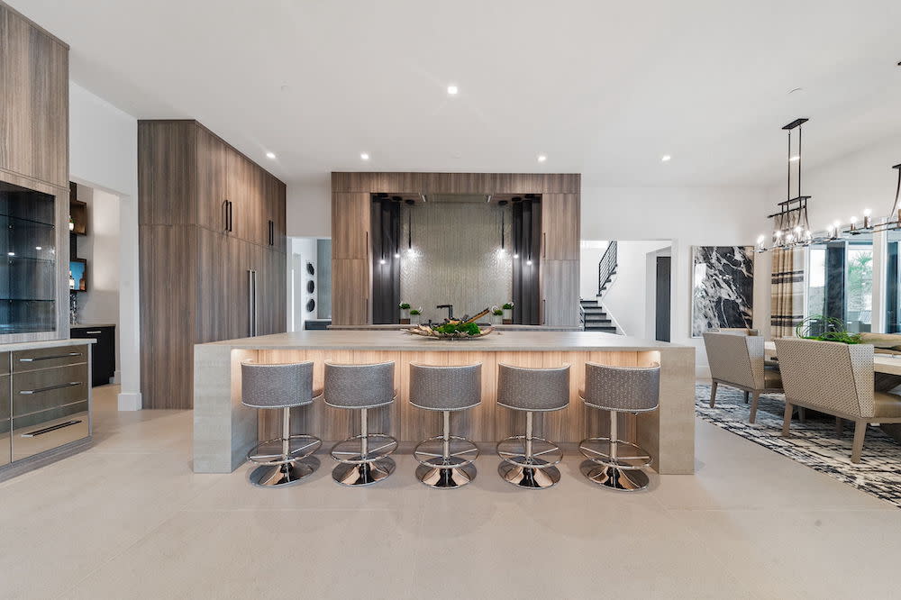 Neutral beige kitchen with seating at island.