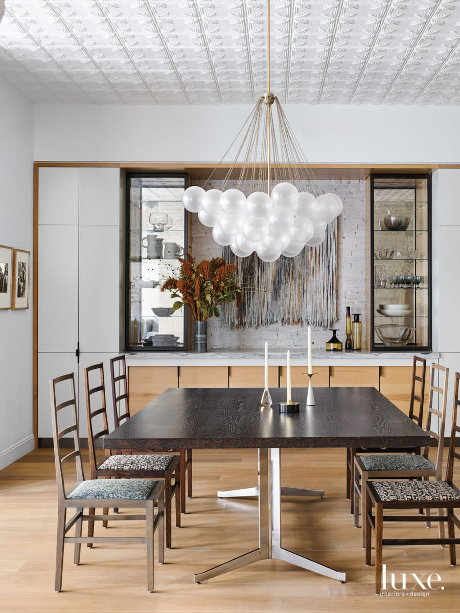 dining room with circular ball chandelier, wet bar