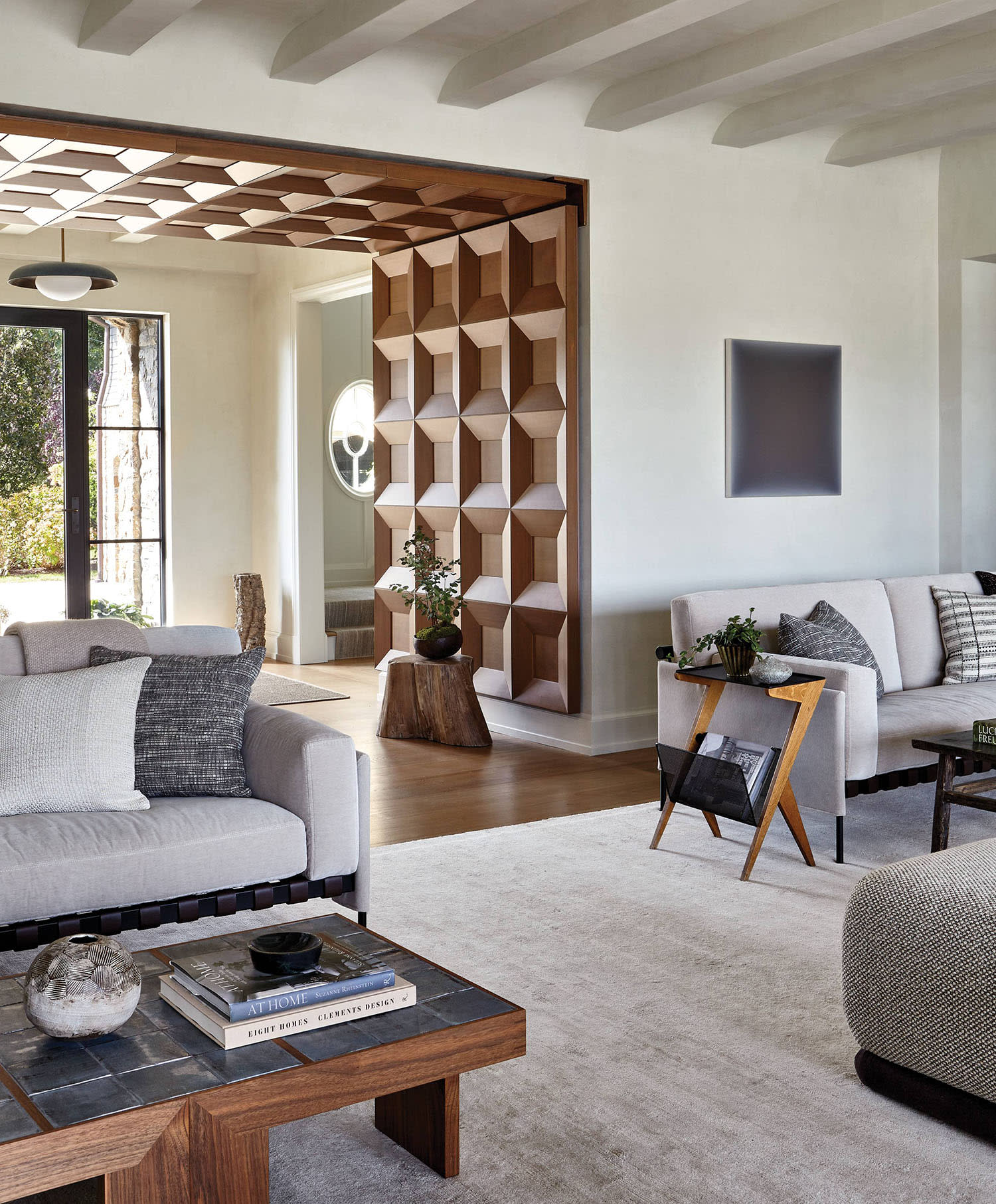coastal-inspired living room with a wood partition