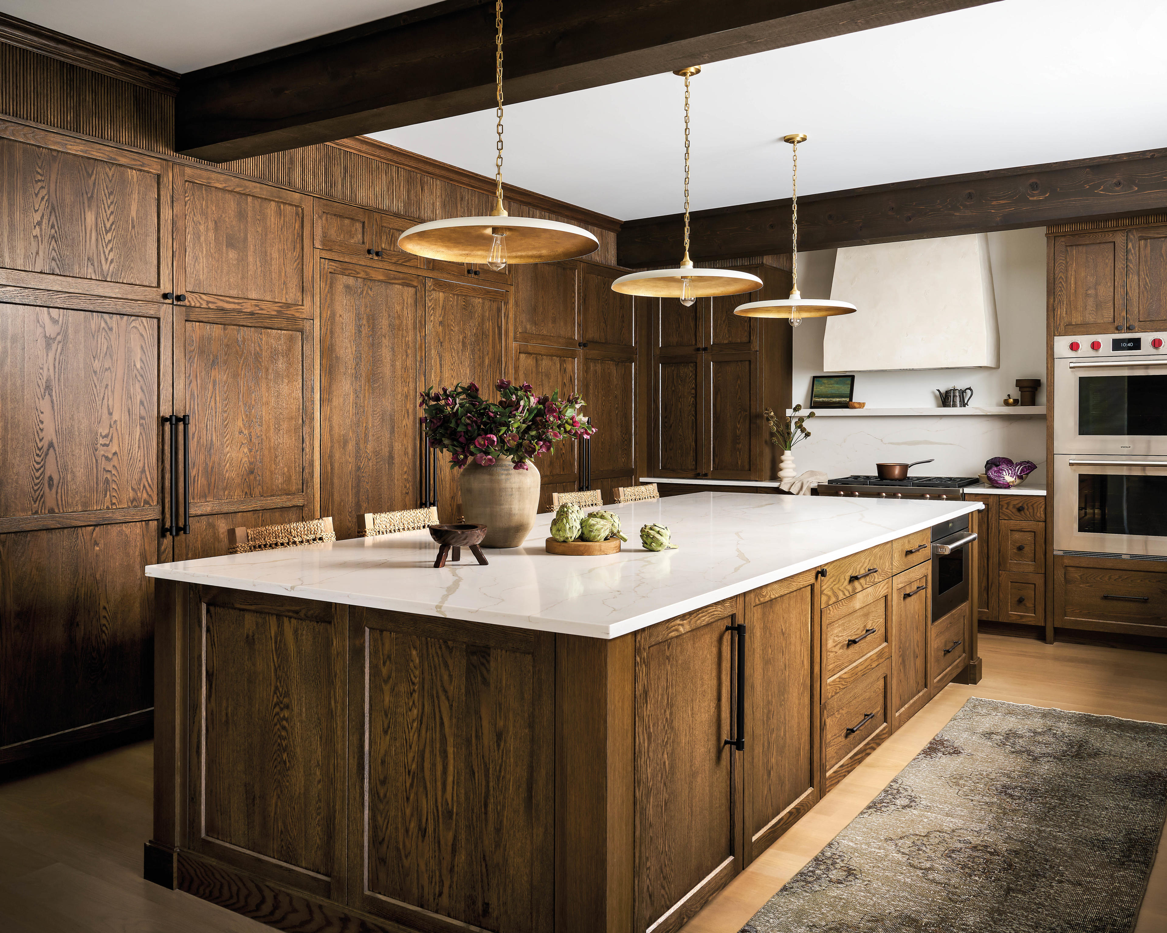 stained oak cabinets line a contemporary kitchen