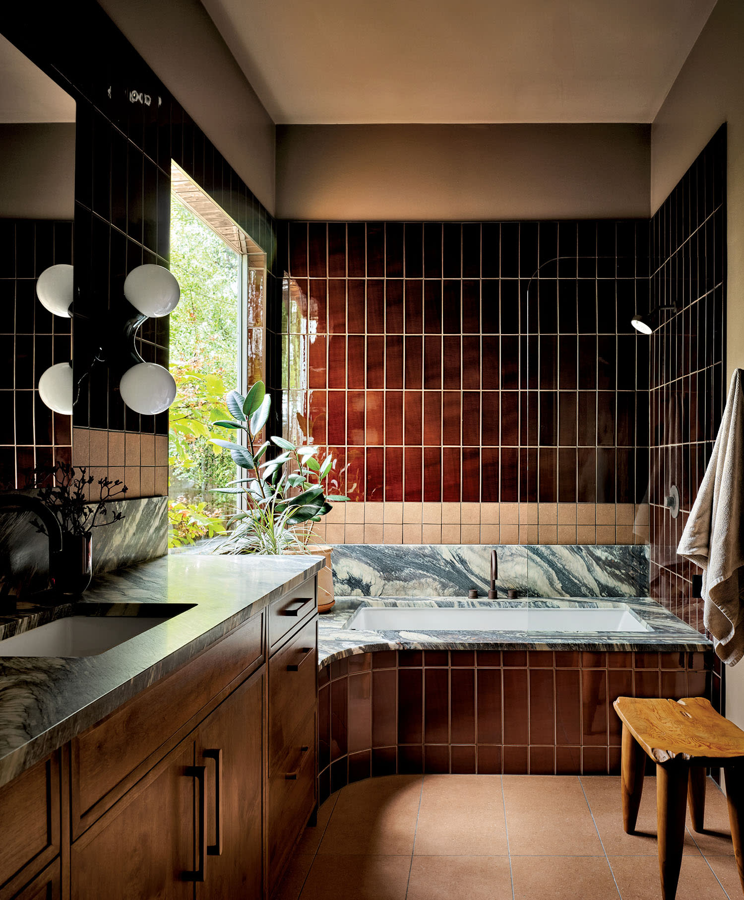 moody bathroom with red vertical tile