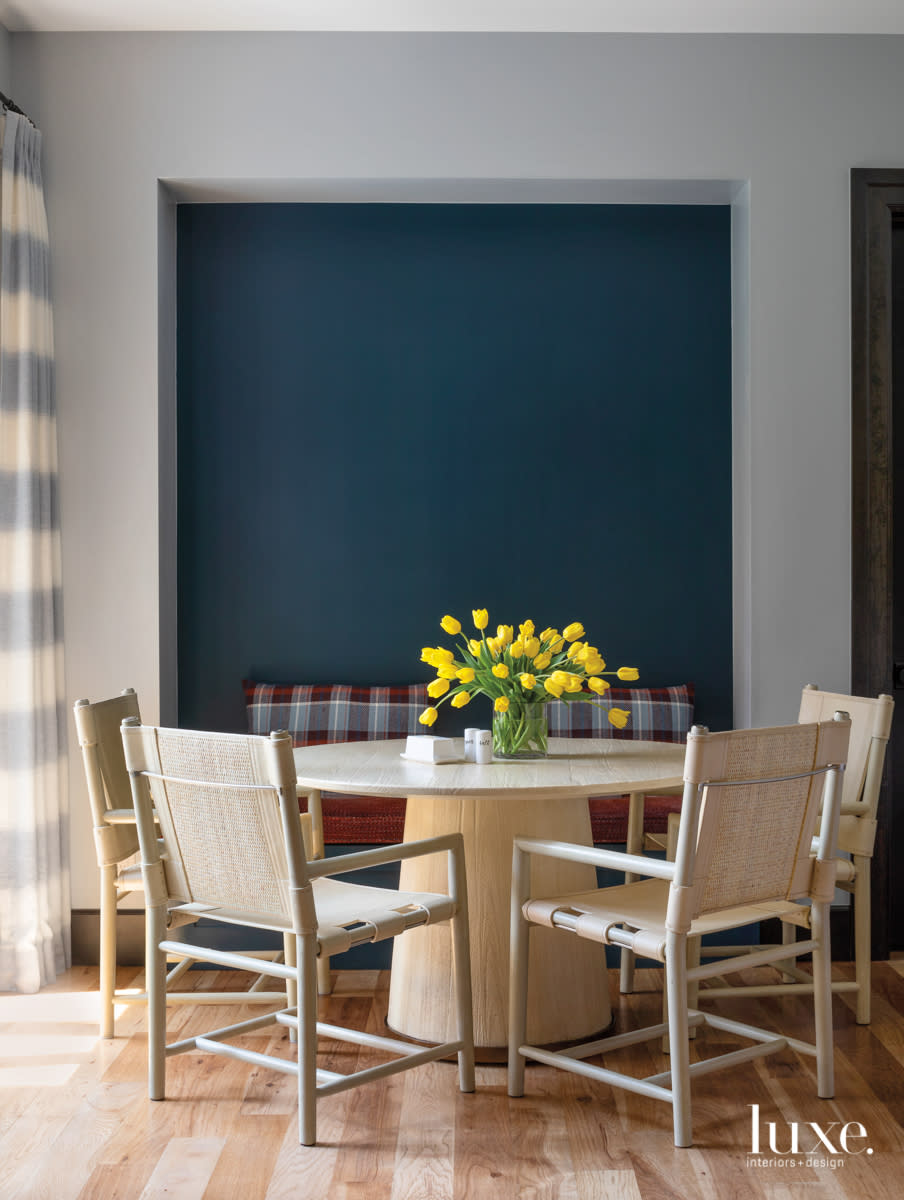 breakfast nook with teal accent wall