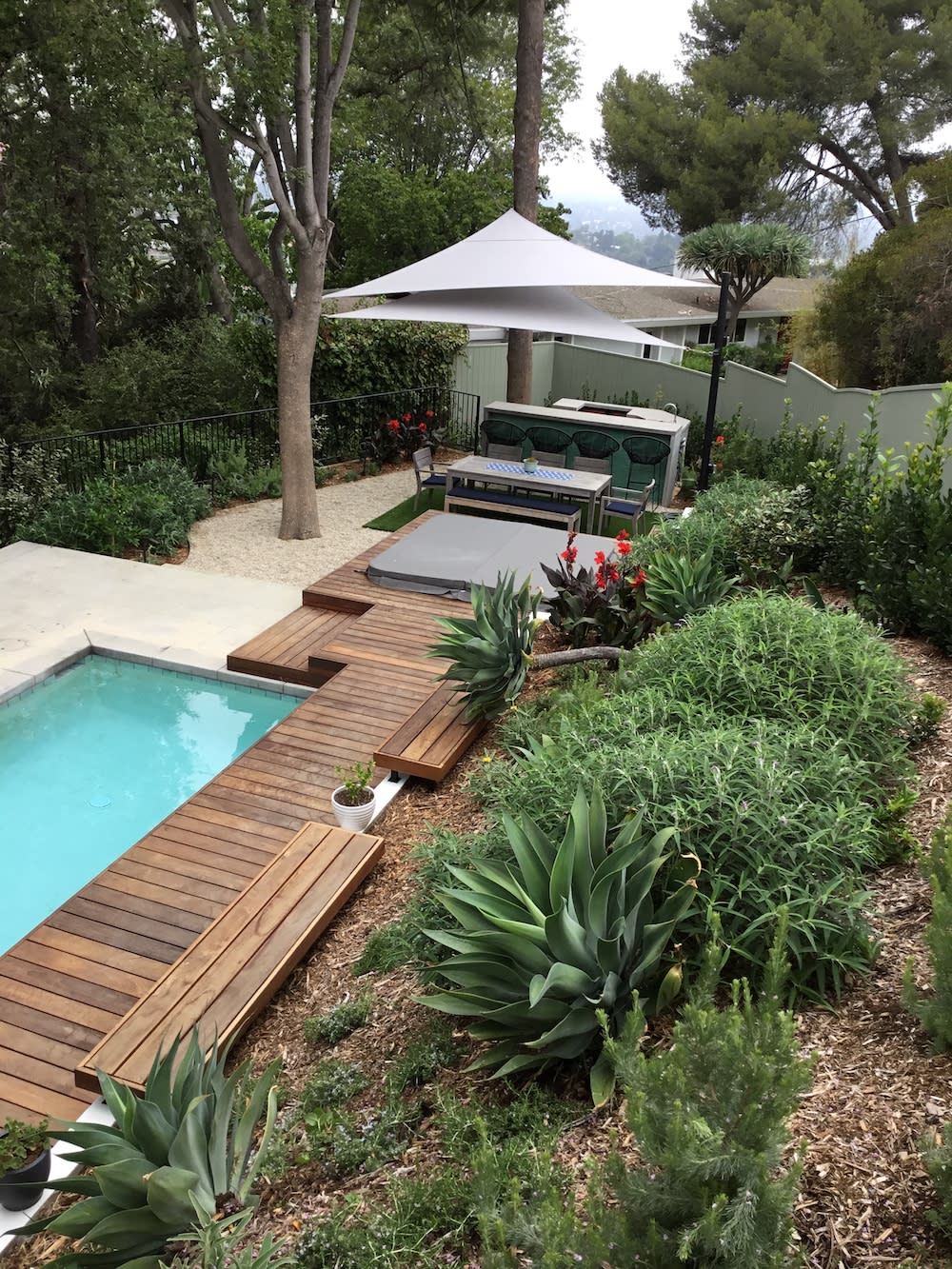 custom shade structure sail panels over outdoor dining table