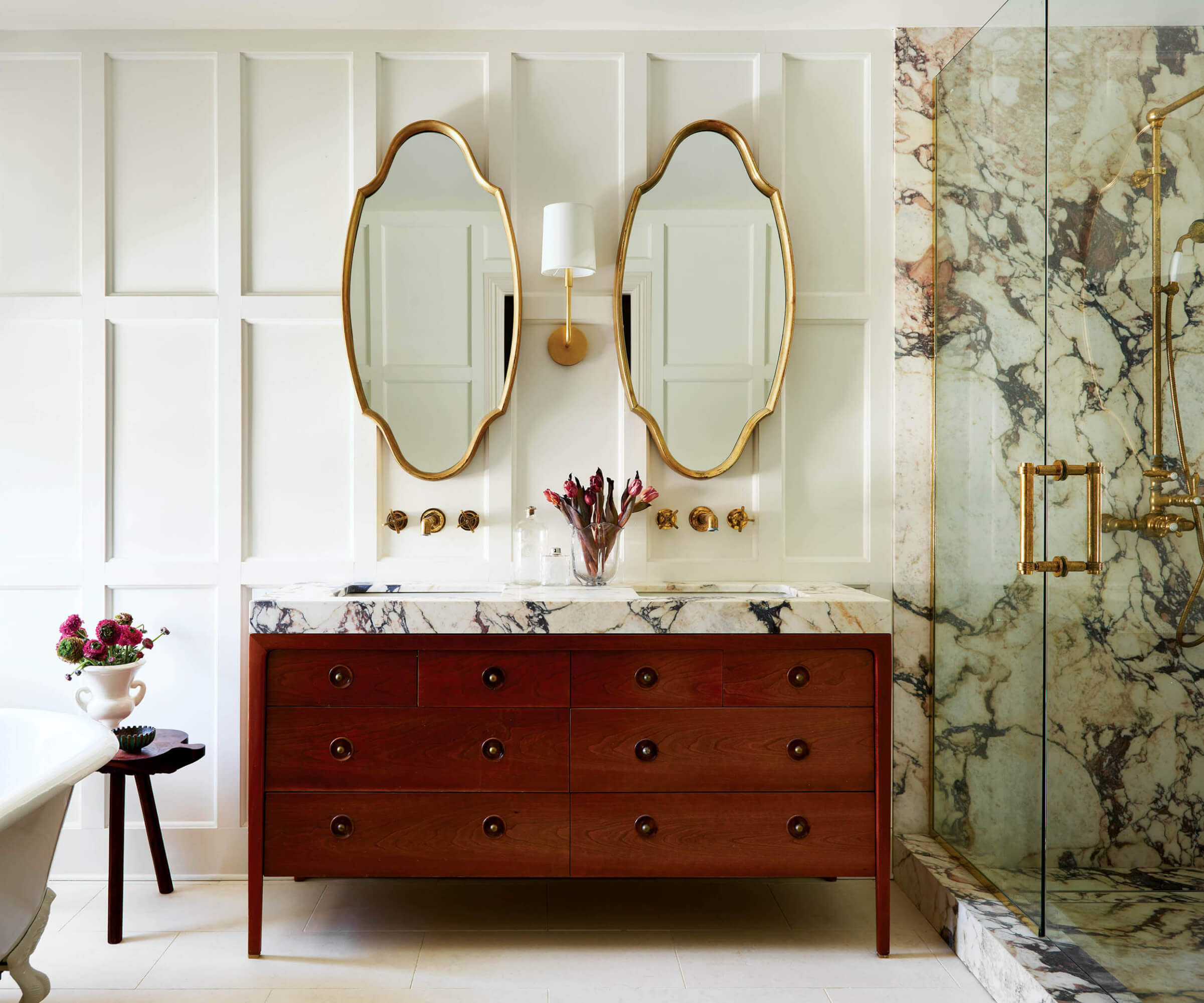 antique dresser turned vanity in a classic neutral bathroom