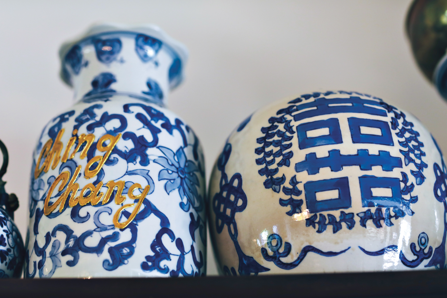 Two artworks by Ken Gun Min on Japanese-style ceramic vases.