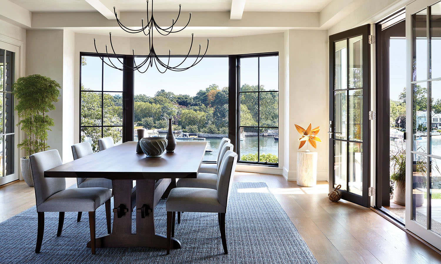 minimalist, airy dining room with views of the Connecticut landscape outside