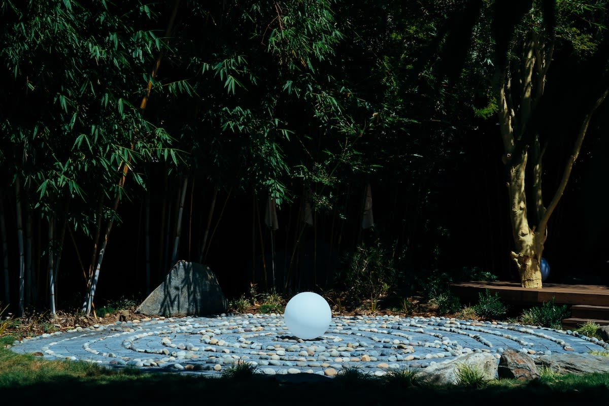 circular stone path surrounded by natural elements.