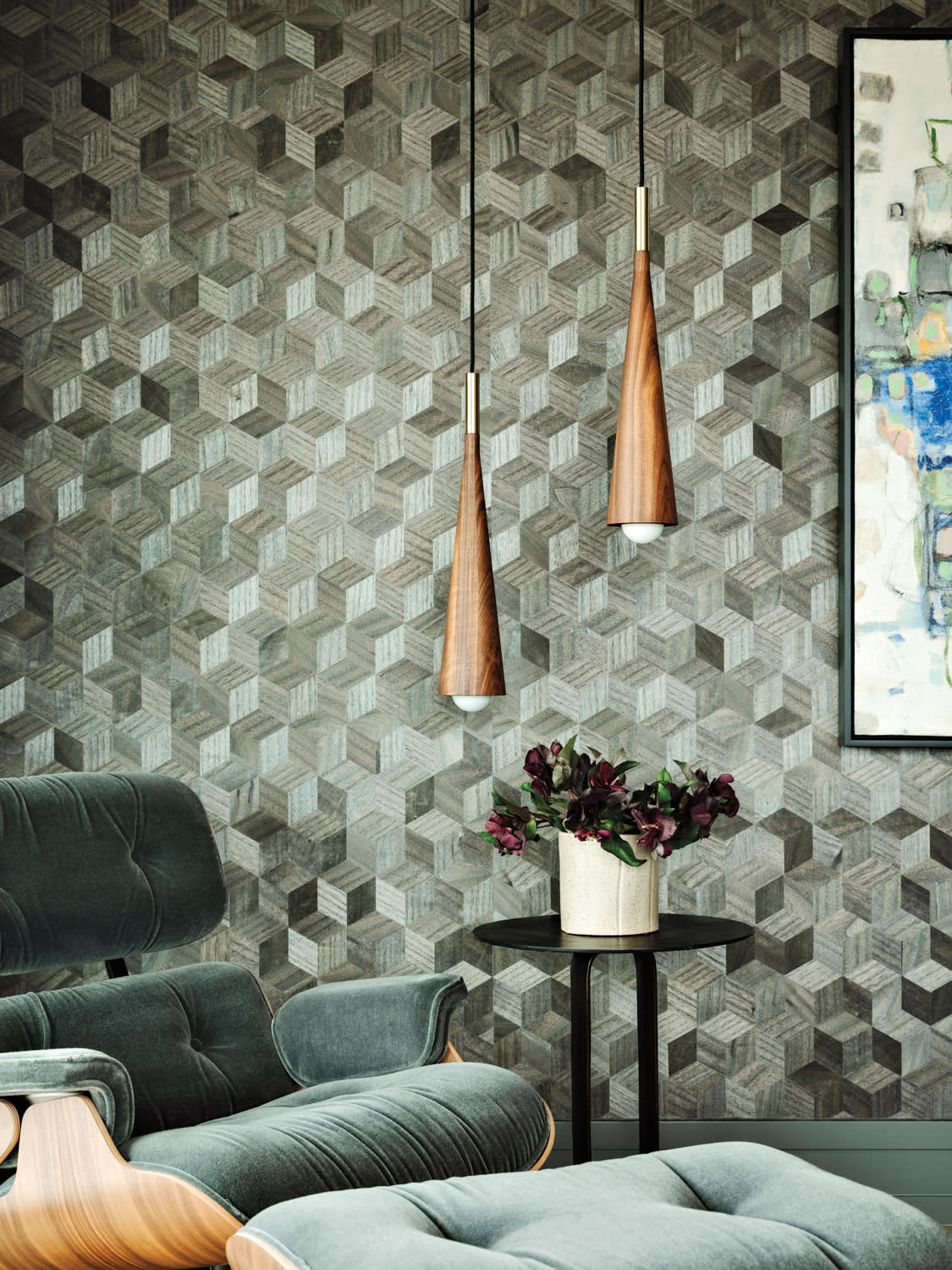green graphic wallcovering in a modern home office with an Eames chair