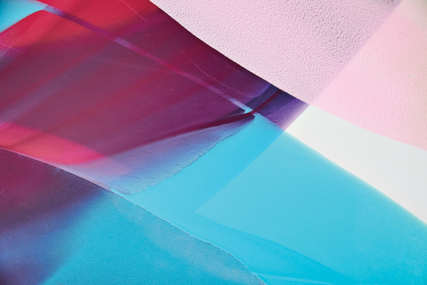 A close-up of gestural paint strokes on canvas