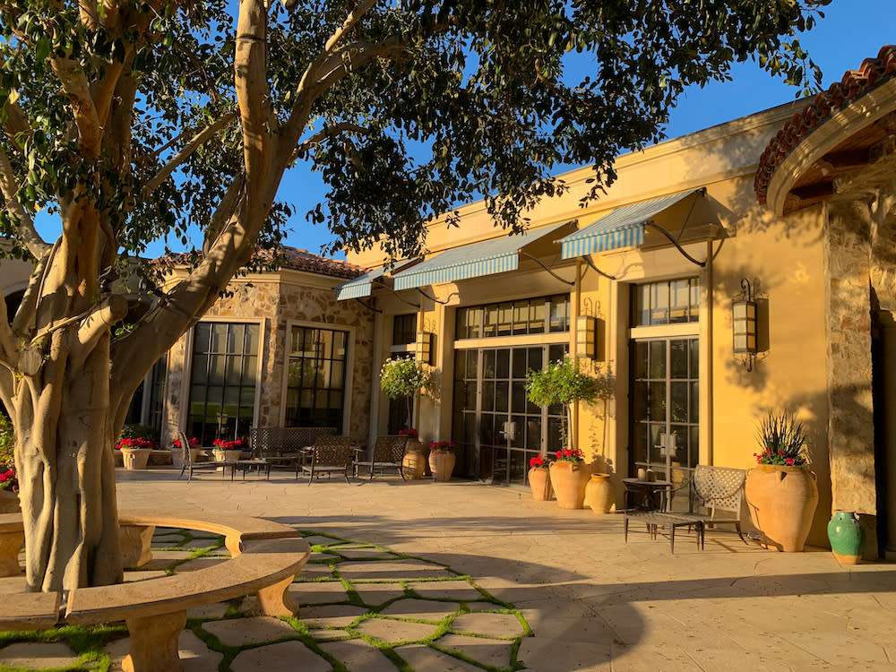 exterior of a Mediterranean California home with awnings