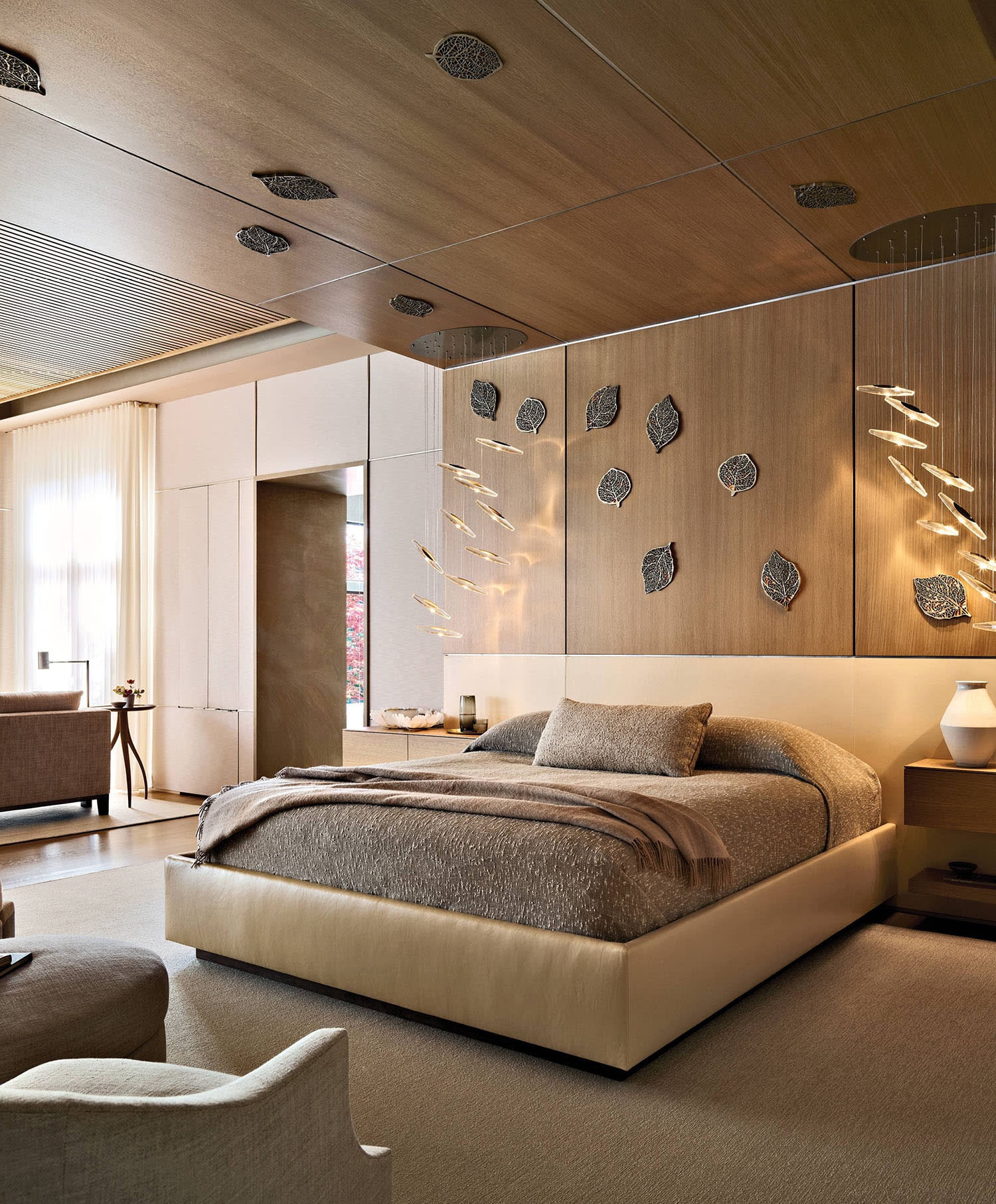 3D-printed leaves line the walls and ceiling of a bedroom