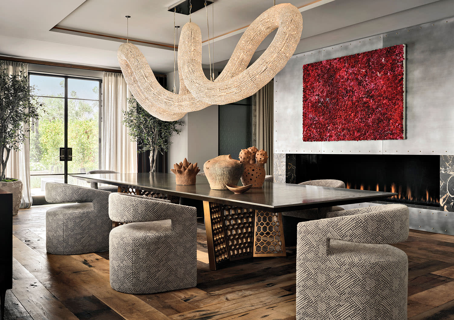 modern dining room with an undulating Wired Custom Lighting chandelier