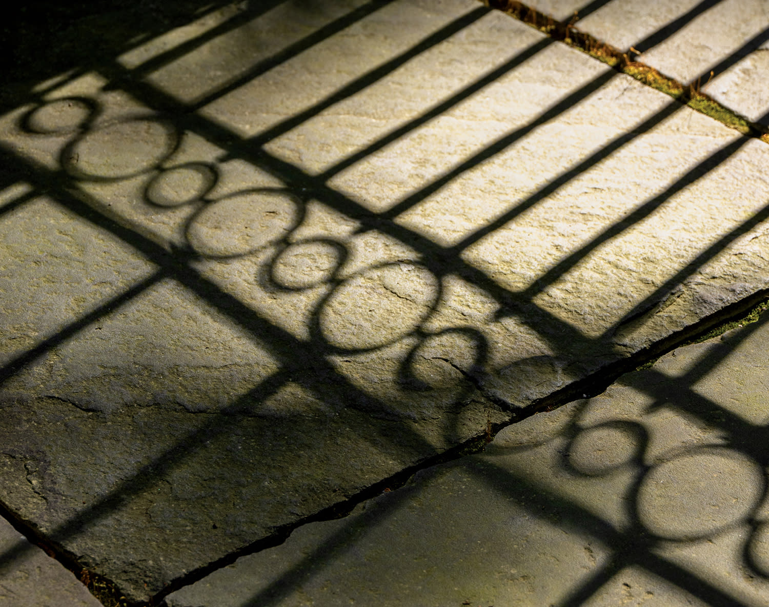 shadow of a courtyard gate's outline