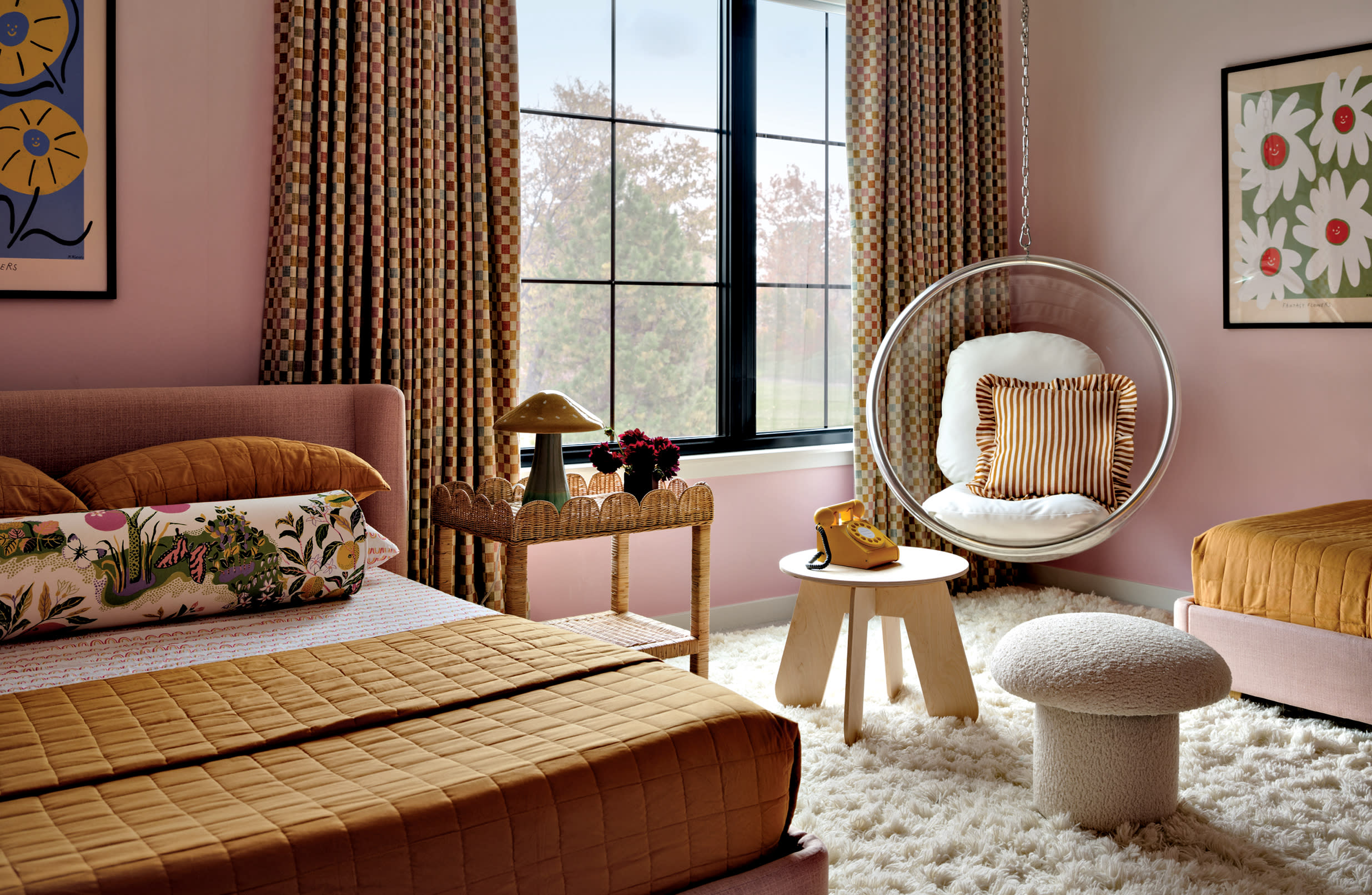 pink childrens bedroom with pops of yellow featuring a mushroom ottoman and a lucite chair