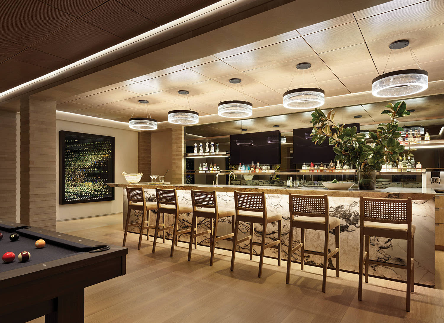 home bar with a veined quartzite countertop 