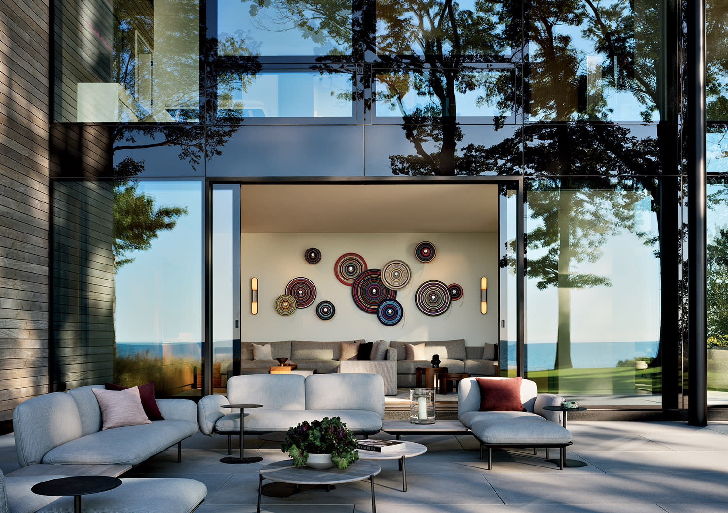 modern home patio with doors opening to a Jürgen Paas piece inside