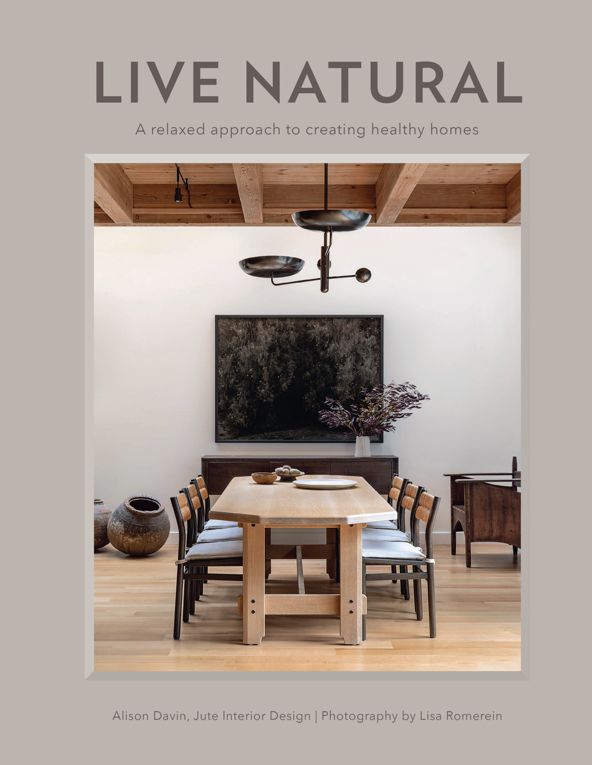 Cover of book, "Live Natural" featuring a wooden dining table and chairs.