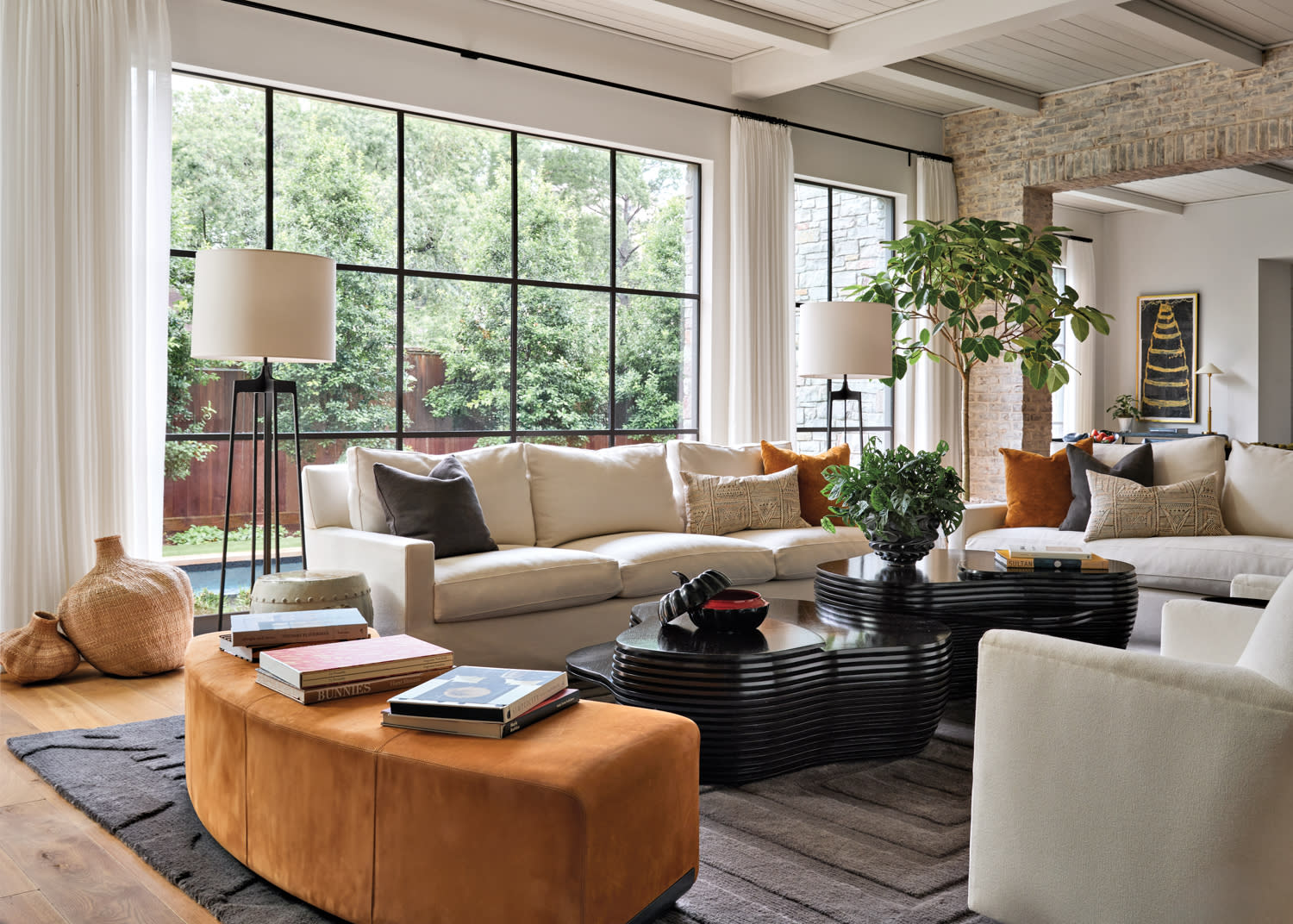 modern living room with large windows and sofas