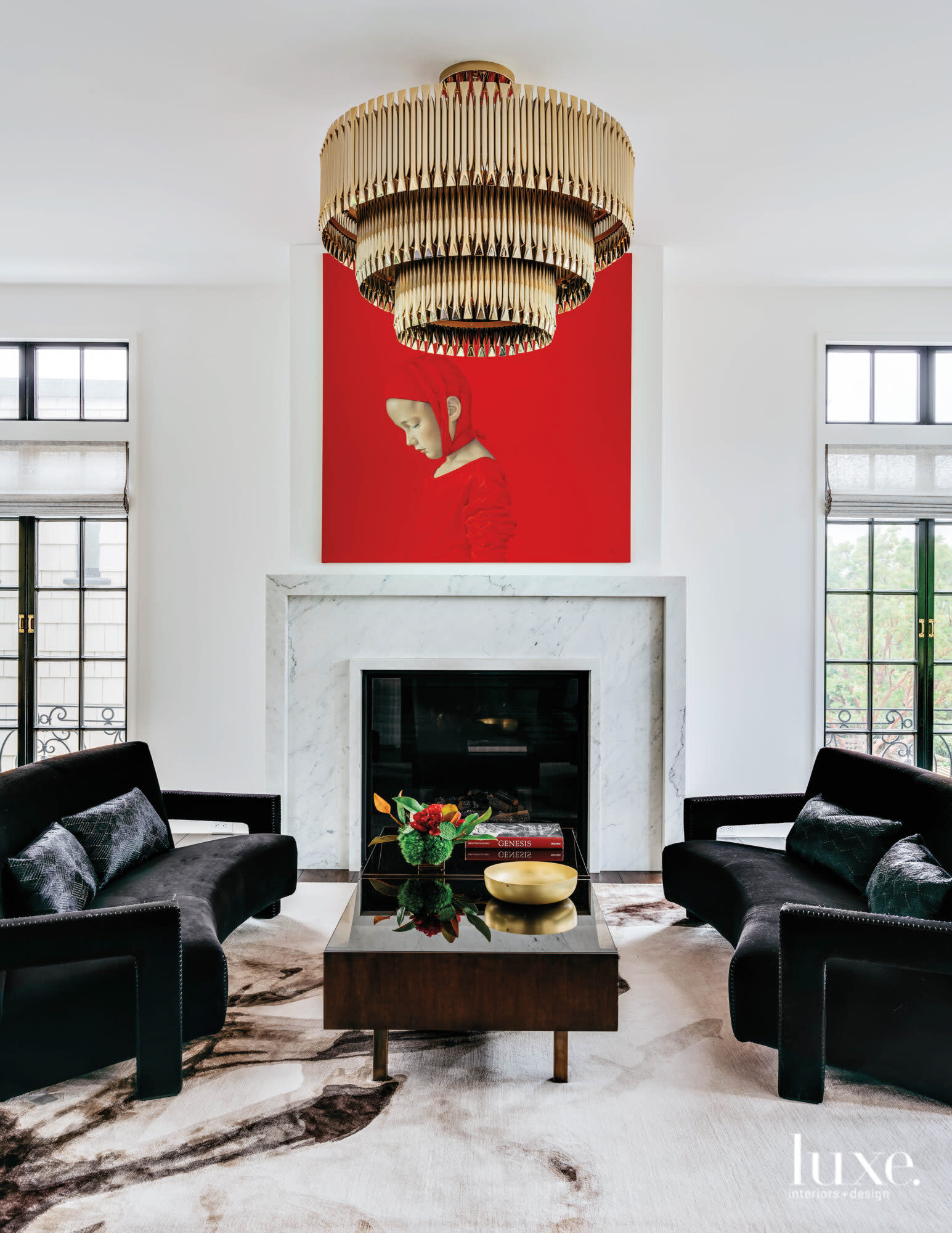 A black and white living room is the backdrop for a bright red artwork.