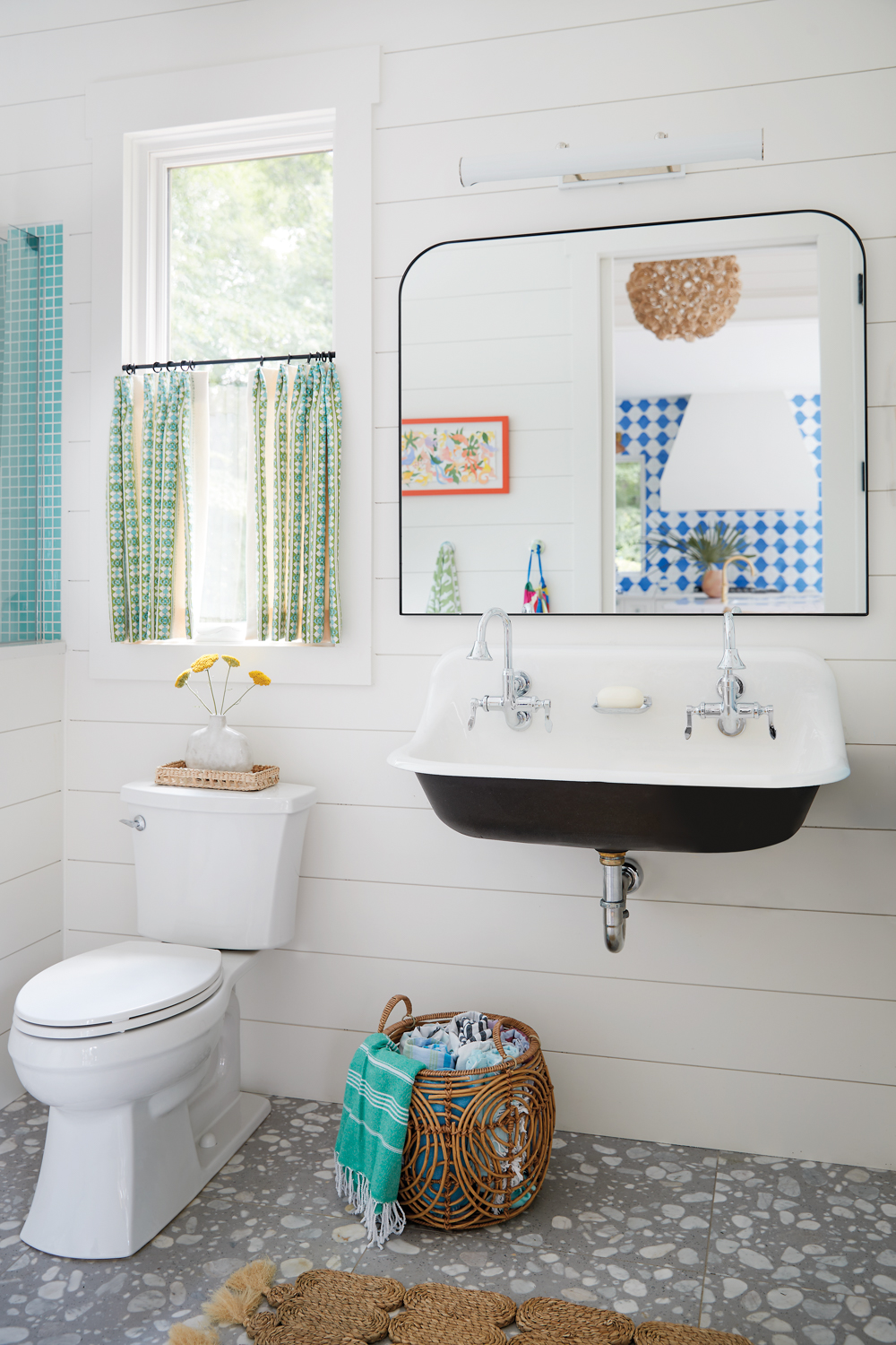 pool house bathroom with gray and white terrazzo flooring and white walls