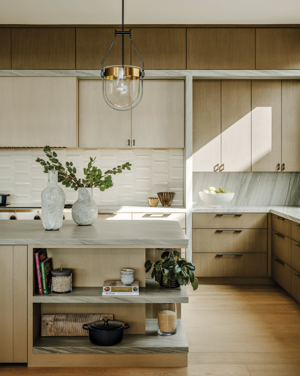 kitchen vignette with a Glacier White leathered quartzite-topped island