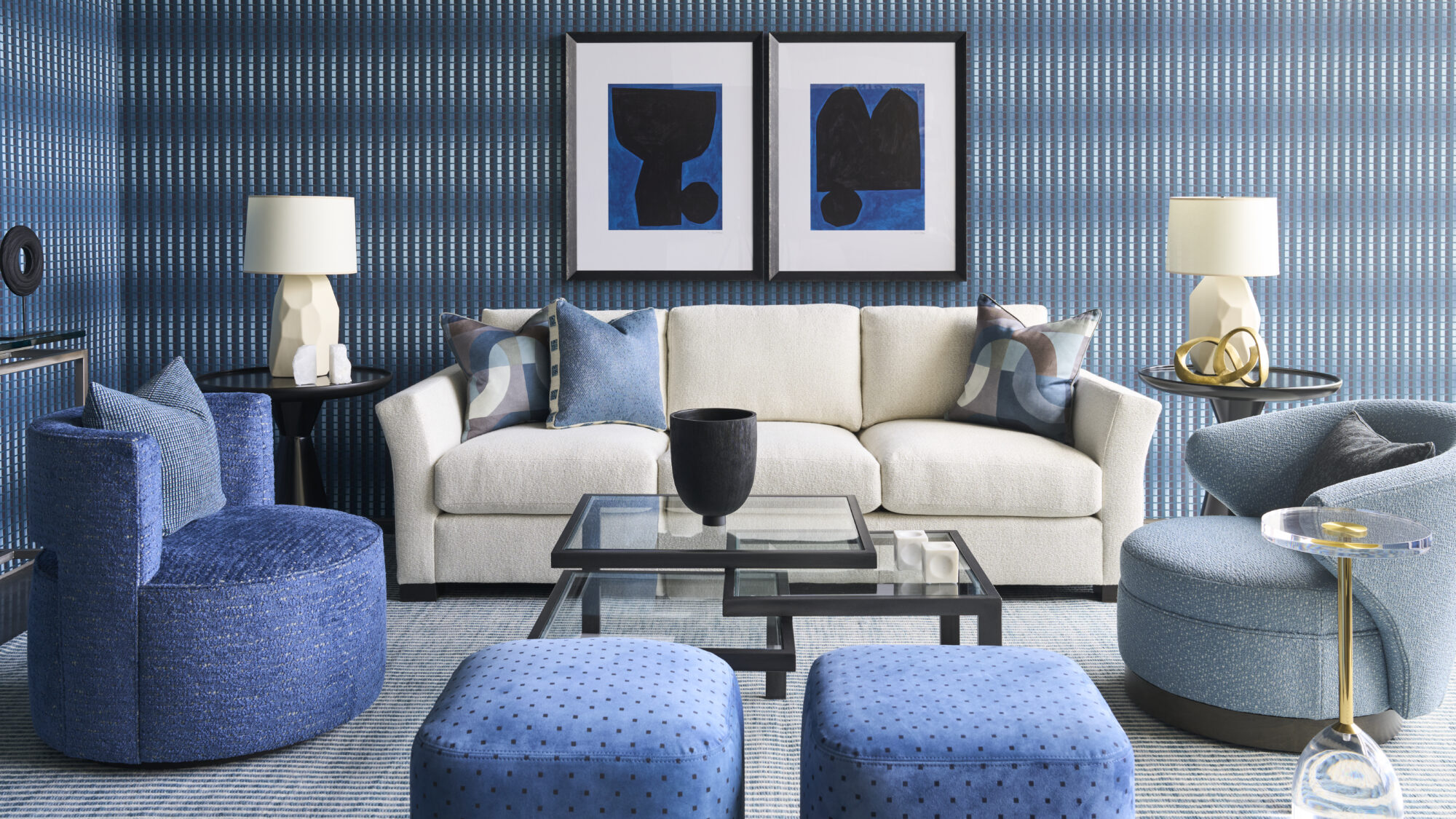 Predominantly blue room flanked by swivel chairs in two styles