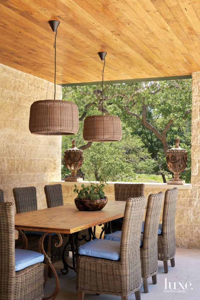 outdoor french dining table with woven pendants 