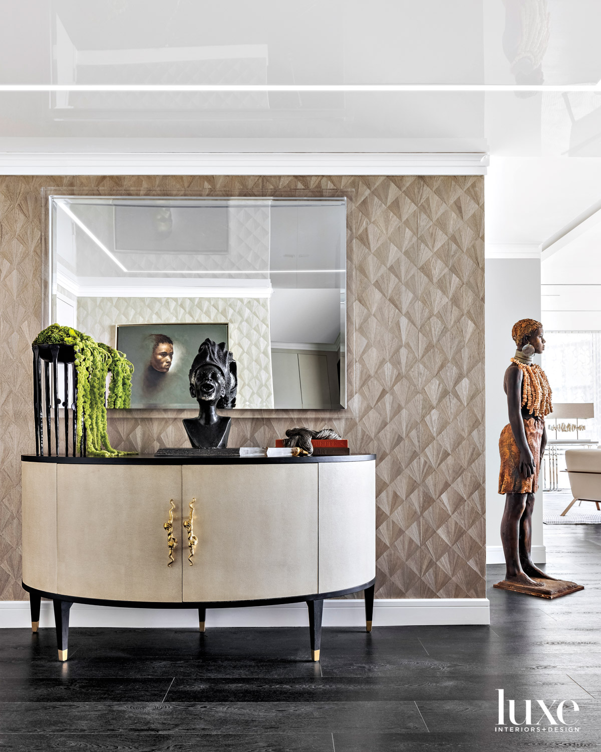 foyer with statement wall, sideboard and African-inspired artworks