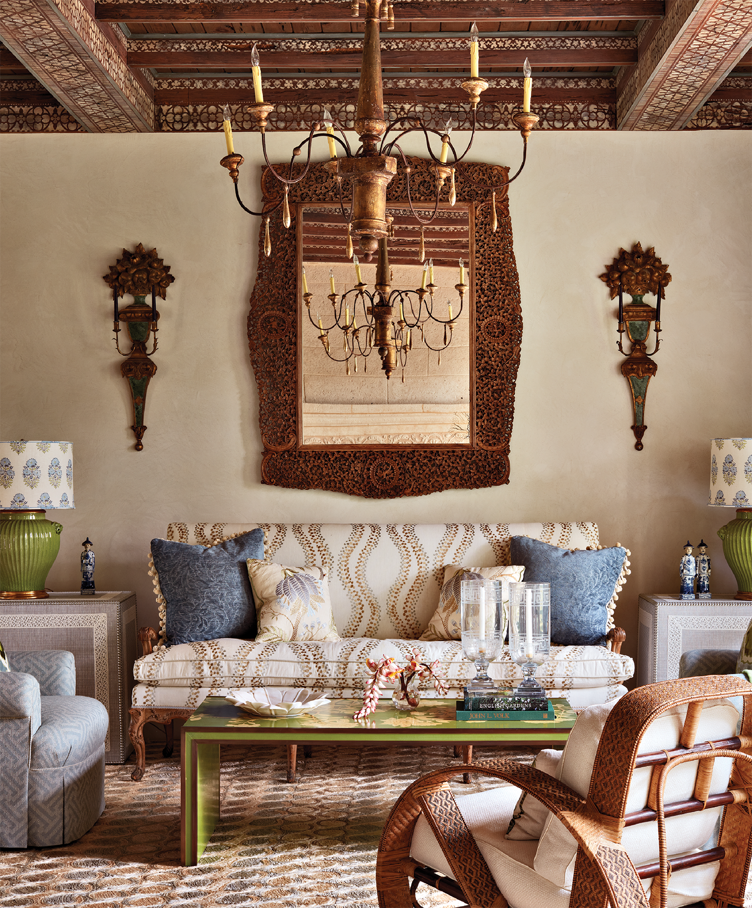living room with an antique mirror over a sofa
