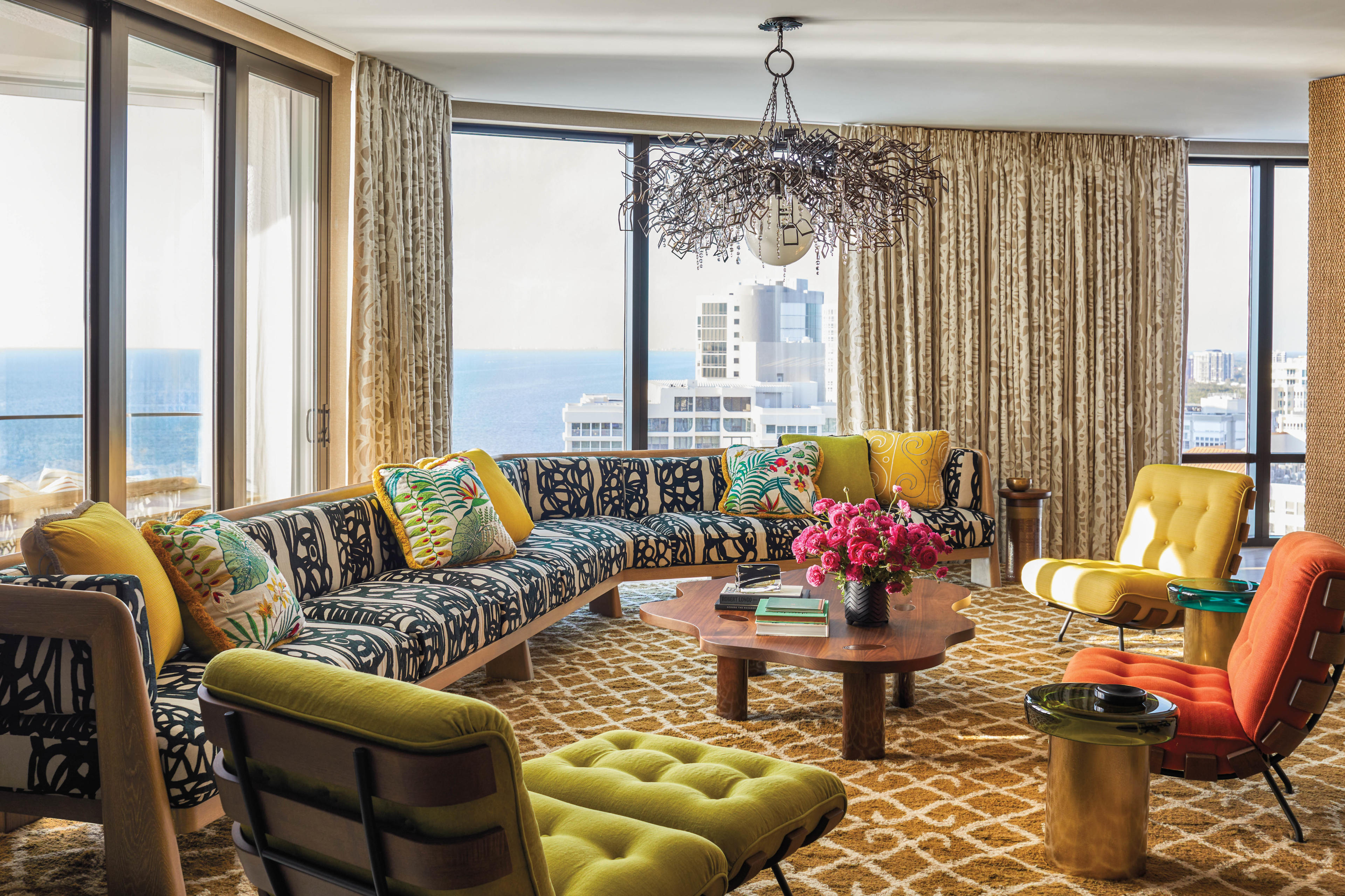 eclectic cabana room with colorful furnishings in various patterns