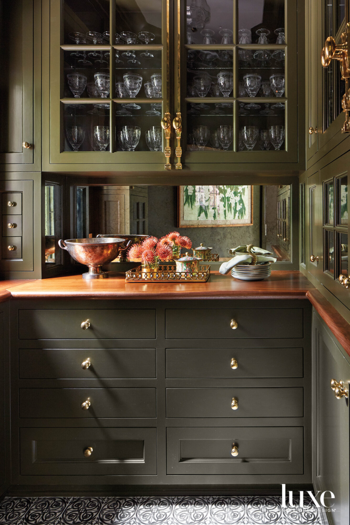 green and wood pantry with flowers and barware