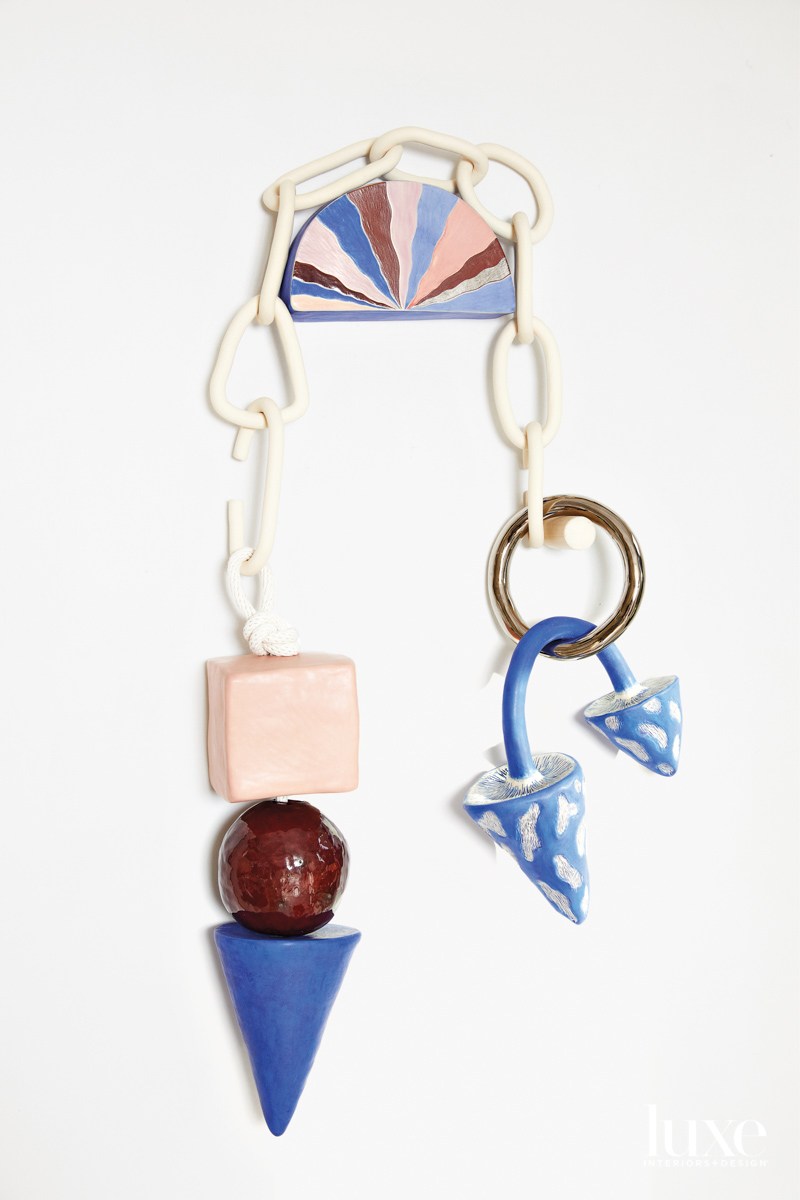 Ceramic sculpture with half-moon and chain